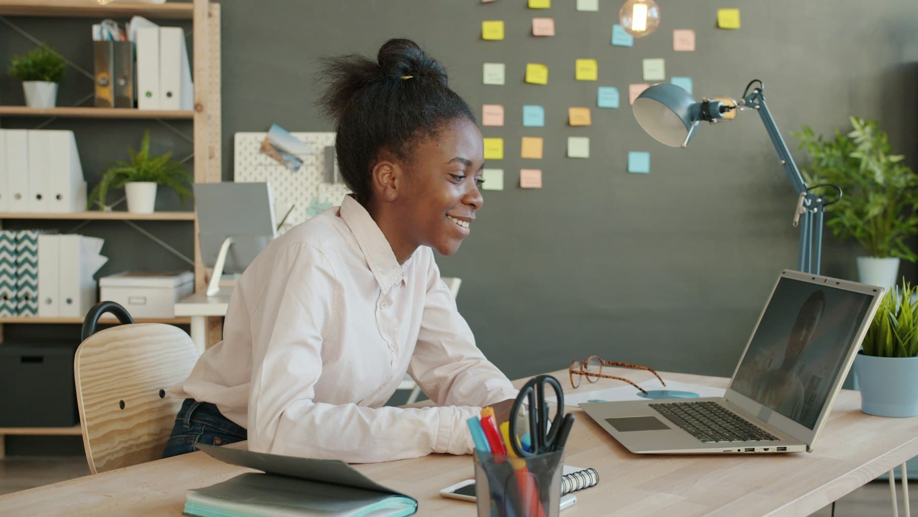 Support specialist helping a customer over a video call